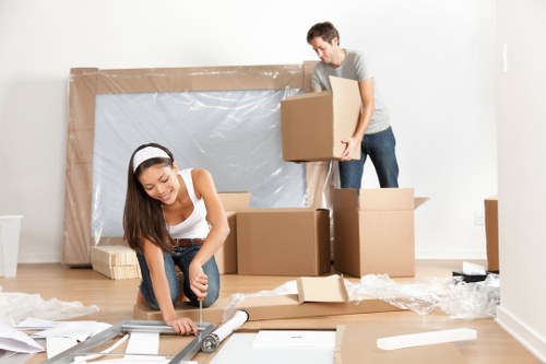 Student removal van loading boxes and furniture in Watford