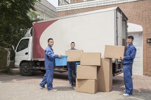 A moving van and helper ready for a local Watford relocation