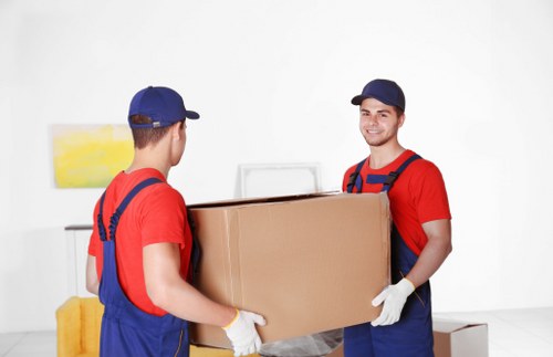 Local man with van loading household items in Watford