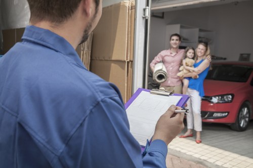 Office furniture and boxes prepared for a same day business move in Watford