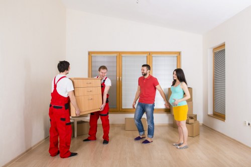 Furniture being carefully loaded into a van in Watford