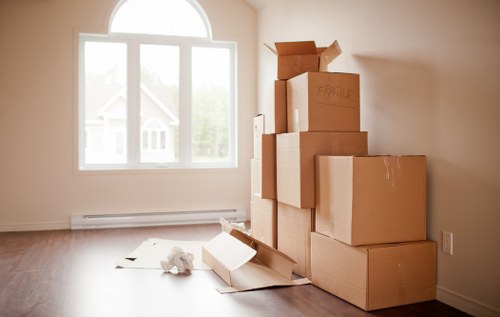 Professional furniture removal crew transporting office and home furniture in Watford