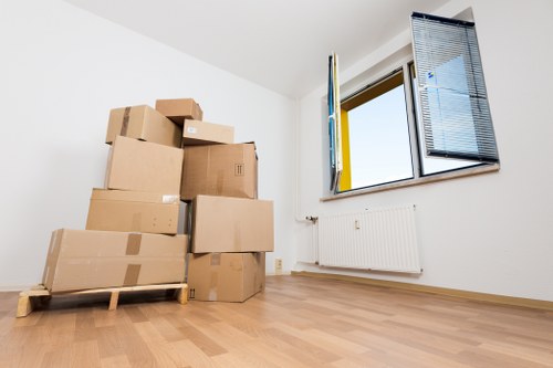Packed moving boxes ready for removal services in Watford