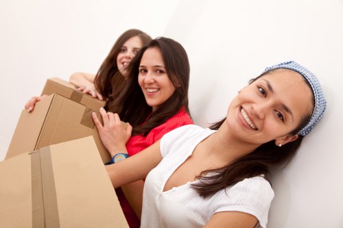 Careful wrapping of fragile household items before a Watford move