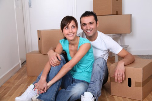 Packed boxes and furniture ready for urgent removals in a Watford home