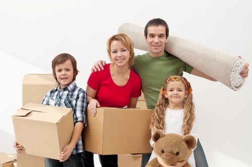 Professional team handling old furniture collection in Watford