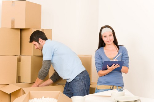 Careful movers organizing belongings for transport in Watford